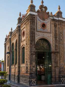 Stunning view of historic architecture at Sector La Victoria in Puebla, Mexico, featuring unique stonework and design.